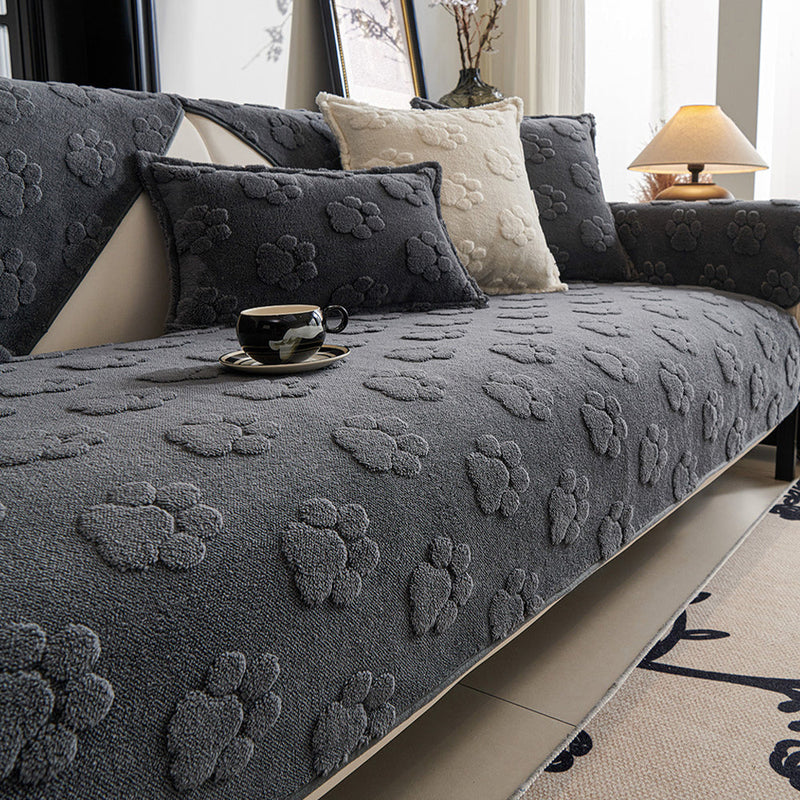Sofaauflage aus Plüsch mit Pfotenrelief und Rutschhemmung