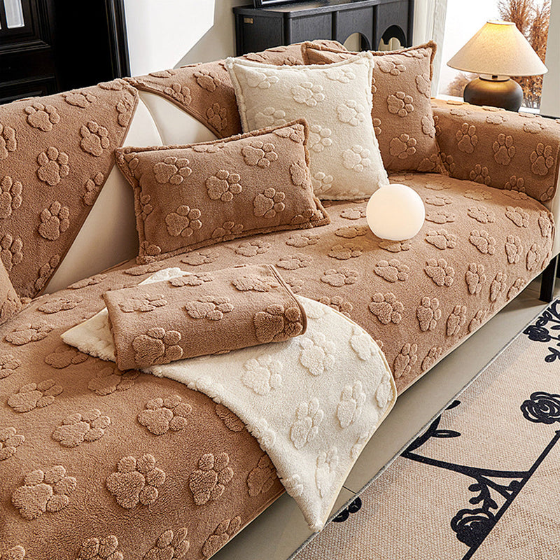 Sofaauflage aus Plüsch mit Pfotenrelief und Rutschhemmung