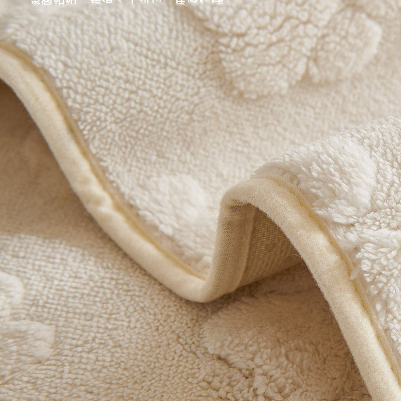 Sofaauflage aus Plüsch mit Pfotenrelief und Rutschhemmung