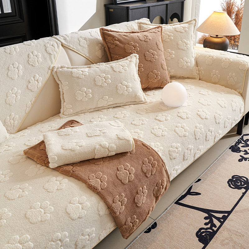 Sofaauflage aus Plüsch mit Pfotenrelief und Rutschhemmung