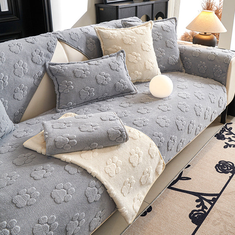 Sofaauflage aus Plüsch mit Pfotenrelief und Rutschhemmung