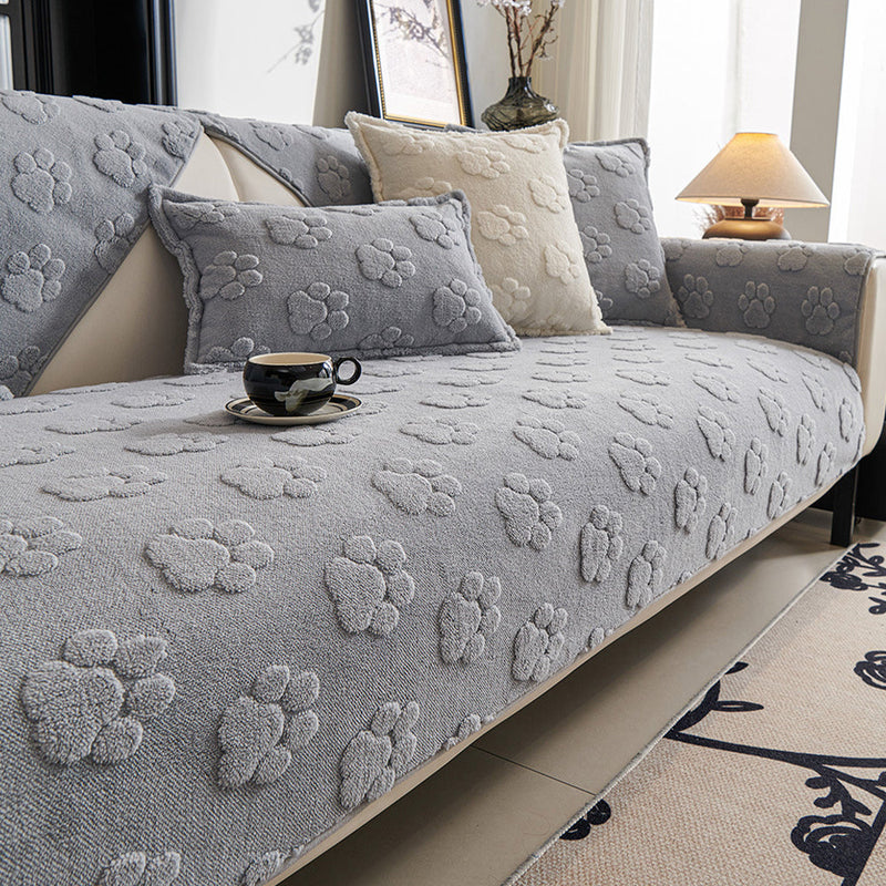 Sofaauflage aus Plüsch mit Pfotenrelief und Rutschhemmung